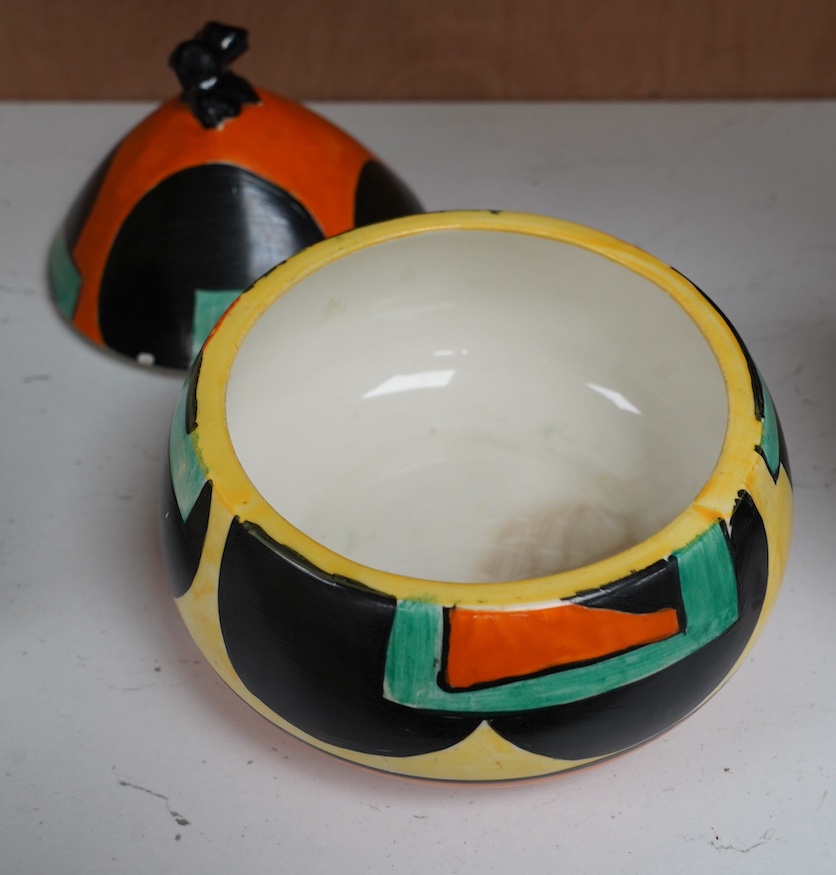 A Clarice Cliff Bizarre bon-bon jar and cover, 14cm. Condition - poor to fair, discoloured crazing to interior